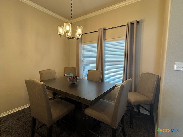 dining area with a chandelier, ornamental molding, carpet flooring, and baseboards