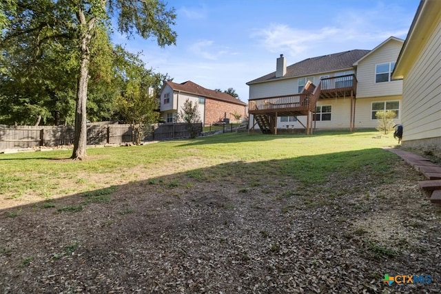 view of yard with a wooden deck