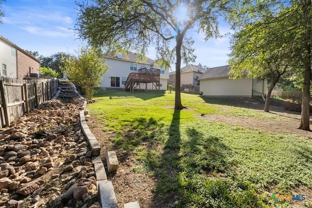 view of yard featuring a wooden deck