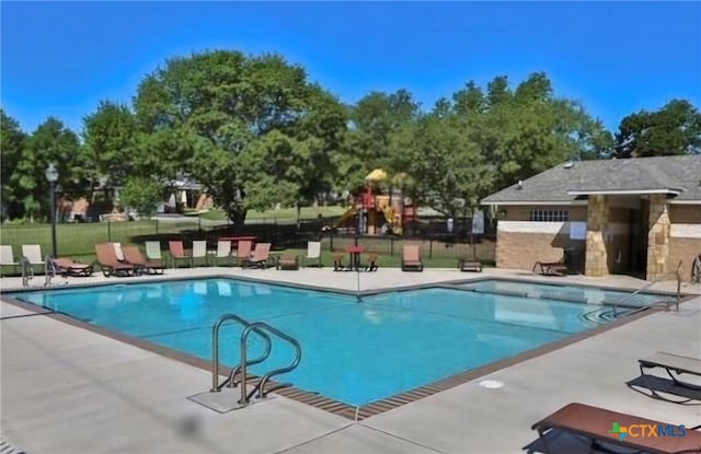 view of swimming pool with a patio area