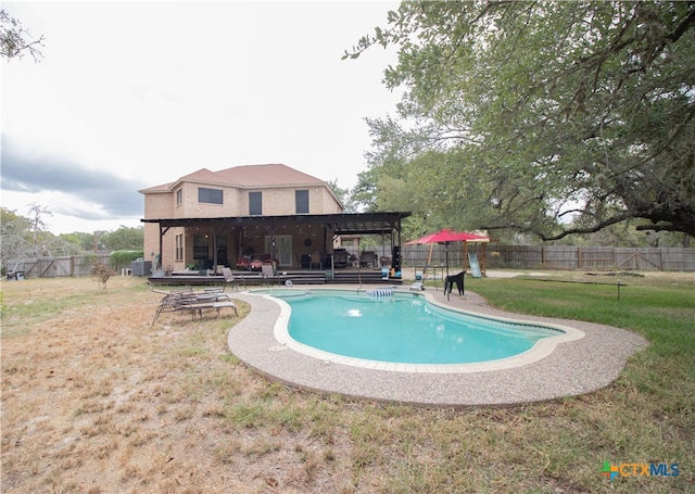 view of swimming pool featuring central air condition unit, a pergola, a patio, and a yard