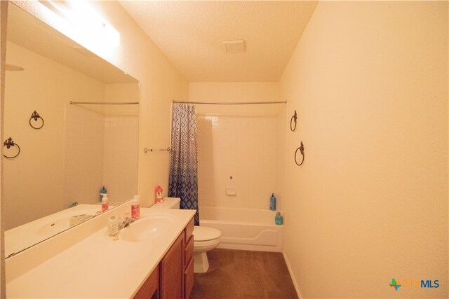 full bathroom with toilet, vanity, a textured ceiling, and shower / bathtub combination with curtain