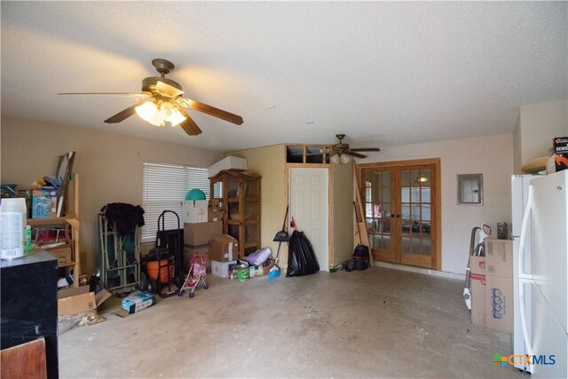 interior space featuring concrete flooring, french doors, a textured ceiling, and ceiling fan