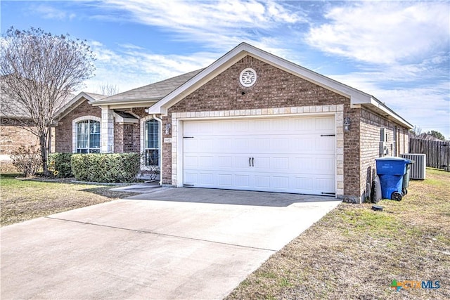 ranch-style home with driveway, brick siding, and an attached garage