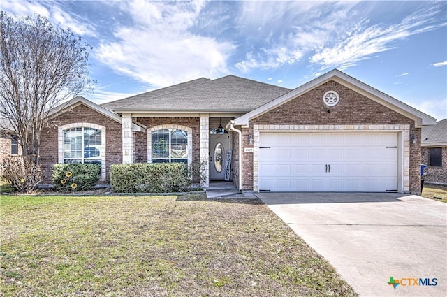 ranch-style home featuring a garage, concrete driveway, roof with shingles, a front lawn, and brick siding