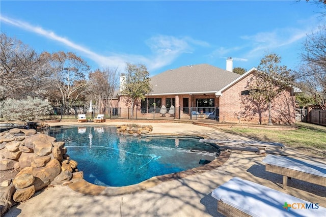 view of pool with a fenced in pool, a patio area, and fence