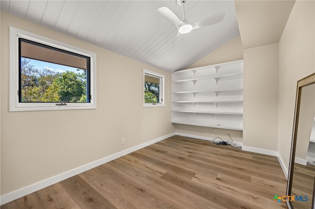 17810 N Rim Dr, Leander, TX 78641 - spare room featuring baseboards, wood finished floors, vaulted ceiling, and ceiling fan