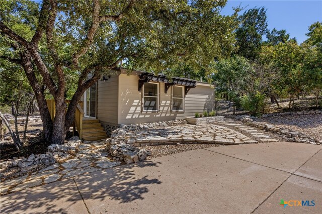 17810 N Rim Dr, Leander, TX 78641 - view of front of home with a patio area