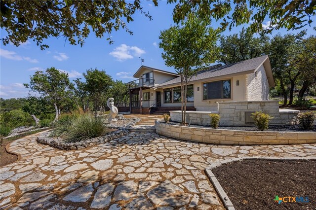 17810 N Rim Dr, Leander, TX 78641 - view of front of home with a balcony and a patio area