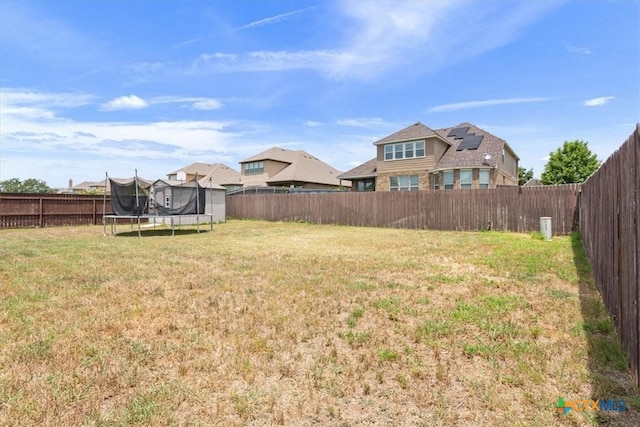 6407 Serpentine Dr, Killeen, TX 76542 - fenced backyard with a trampoline