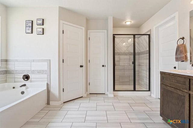 6407 Serpentine Dr, Killeen, TX 76542 - bathroom with a stall shower, a garden tub, and vanity