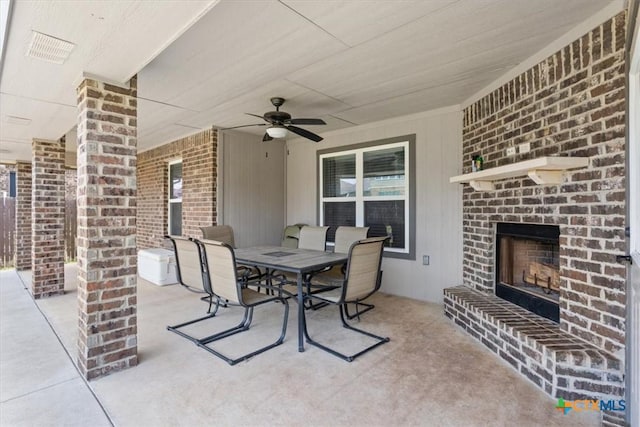 6407 Serpentine Dr, Killeen, TX 76542 - view of patio / terrace featuring an outdoor brick fireplace, outdoor dining space, and a ceiling fan