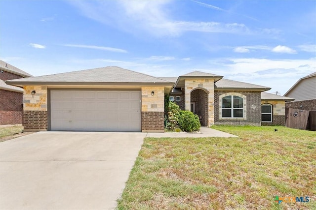 6407 Serpentine Dr, Killeen, TX 76542 - view of front facade with concrete driveway, a garage, a front lawn, and brick siding