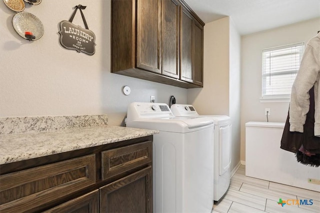 6407 Serpentine Dr, Killeen, TX 76542 - washroom with cabinet space and washing machine and clothes dryer