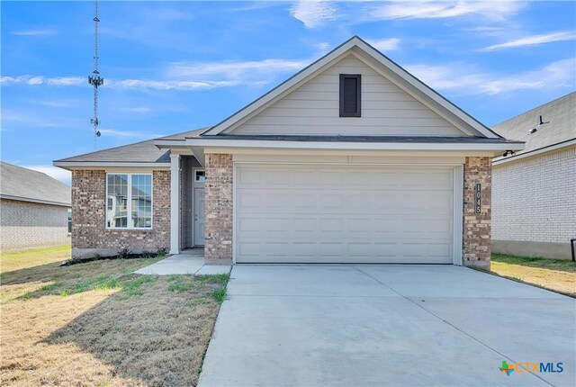 view of front of home featuring a garage, a front yard, and cooling unit