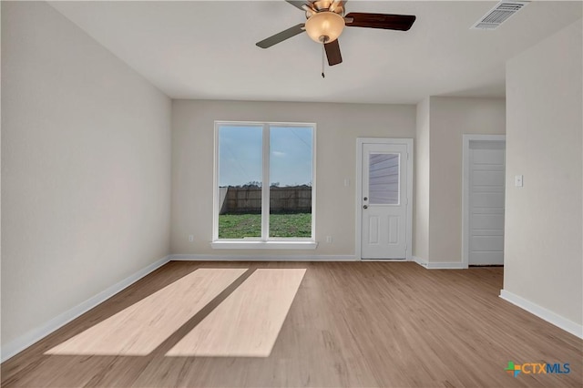 spare room with ceiling fan and light hardwood / wood-style flooring