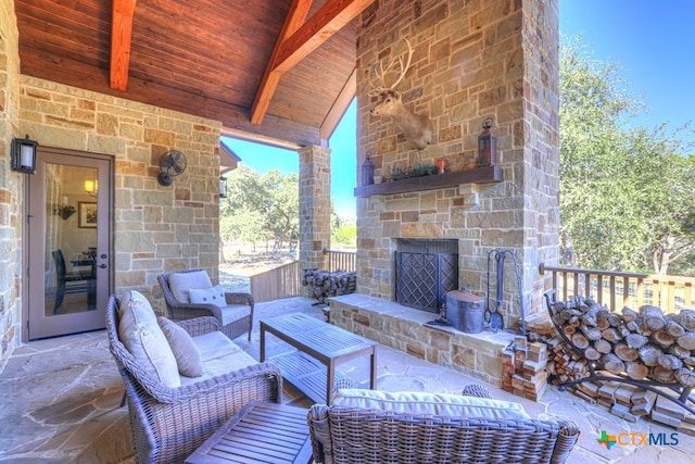 view of patio / terrace featuring an outdoor living space with a fireplace