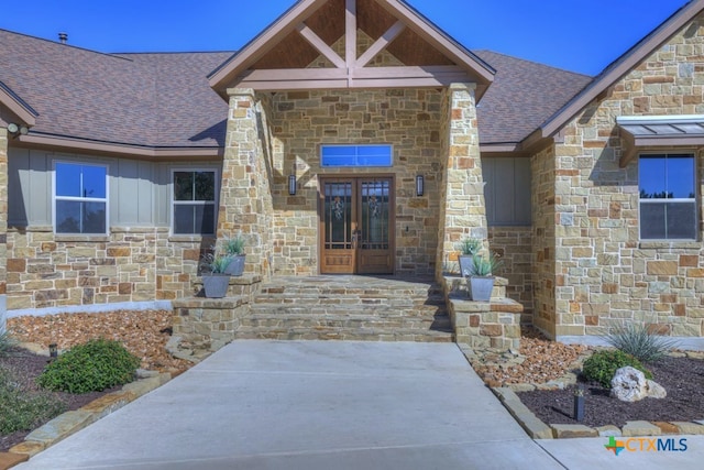 property entrance featuring french doors