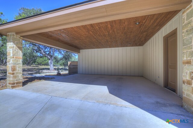 view of patio / terrace featuring a carport