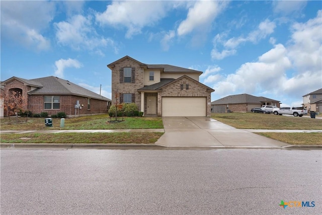 view of front of home featuring a garage and a front lawn