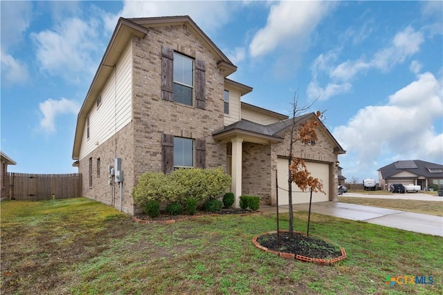 view of property with a garage and a front yard