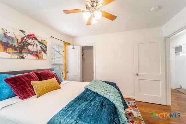 1710 S 15th St, Temple, TX 76504 - bedroom featuring wood finished floors and a ceiling fan