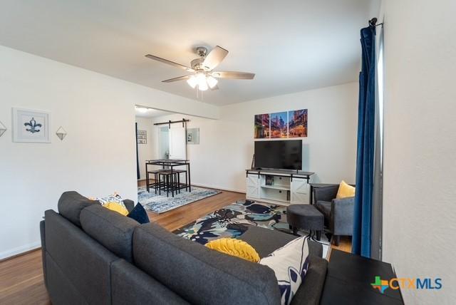 1710 S 15th St, Temple, TX 76504 - living room featuring wood finished floors and a ceiling fan