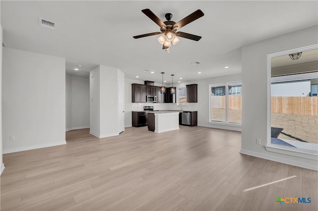 unfurnished living room featuring recessed lighting, visible vents, baseboards, a ceiling fan, and light wood-type flooring