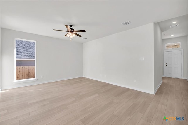 unfurnished room featuring recessed lighting, visible vents, a ceiling fan, light wood-type flooring, and baseboards