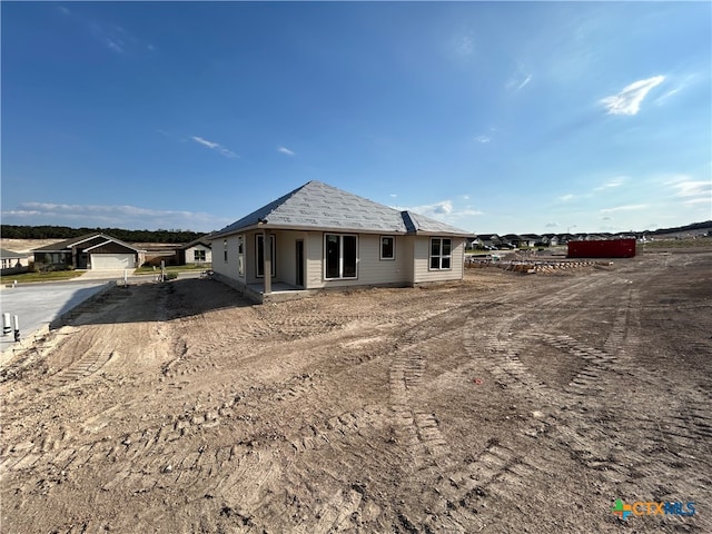 back of house with a garage