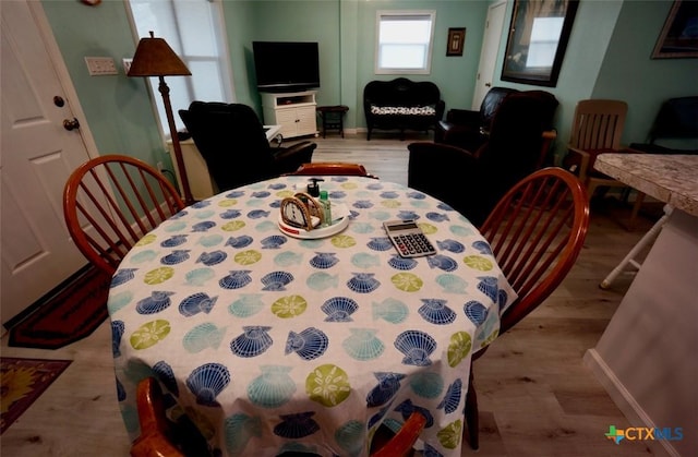 dining area with light wood-type flooring