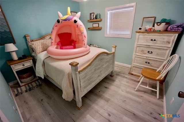 bedroom featuring light hardwood / wood-style flooring