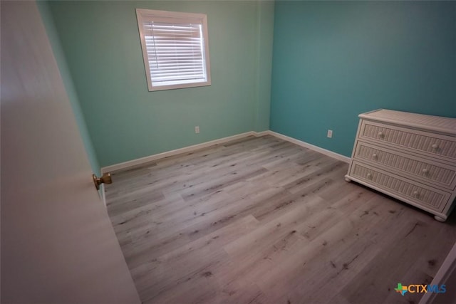 unfurnished room featuring light hardwood / wood-style floors