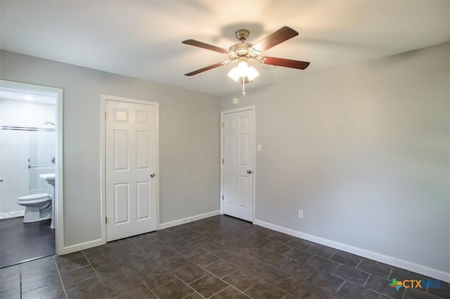 1504 Phyllis Dr, Copperas Cove, TX 76522 - unfurnished bedroom featuring dark tile patterned flooring, ensuite bath, and ceiling fan