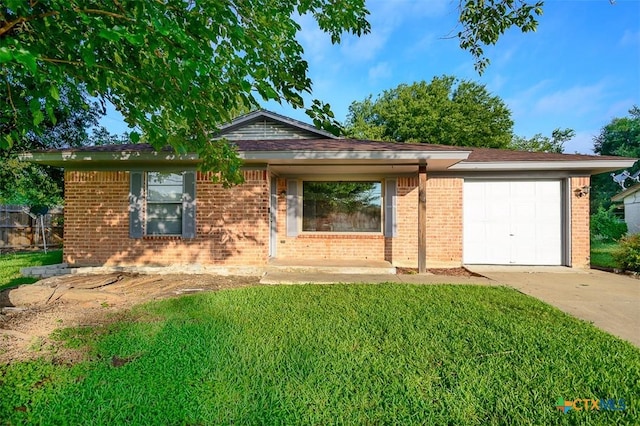 1504 Phyllis Dr, Copperas Cove, TX 76522 - ranch-style house featuring concrete driveway, an attached garage, brick siding, and a front lawn