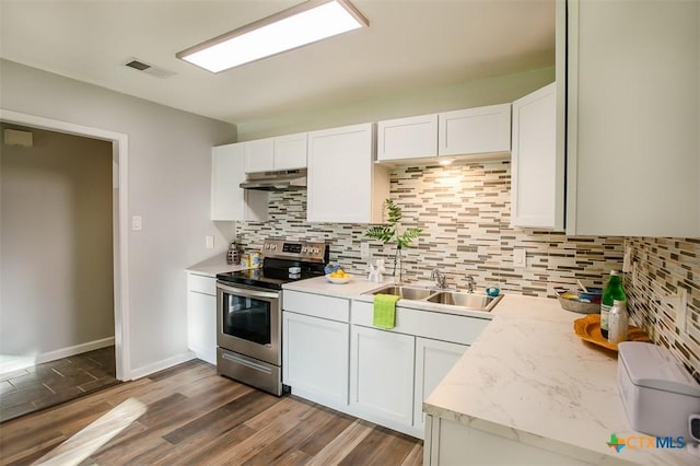 1504 Phyllis Dr, Copperas Cove, TX 76522 - kitchen featuring stainless steel range with electric stovetop, under cabinet range hood, backsplash, and white cabinetry