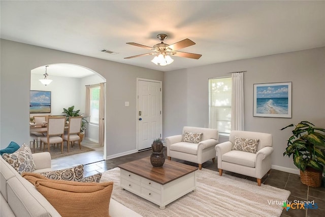 1504 Phyllis Dr, Copperas Cove, TX 76522 - living room featuring arched walkways, tile patterned flooring, and a ceiling fan