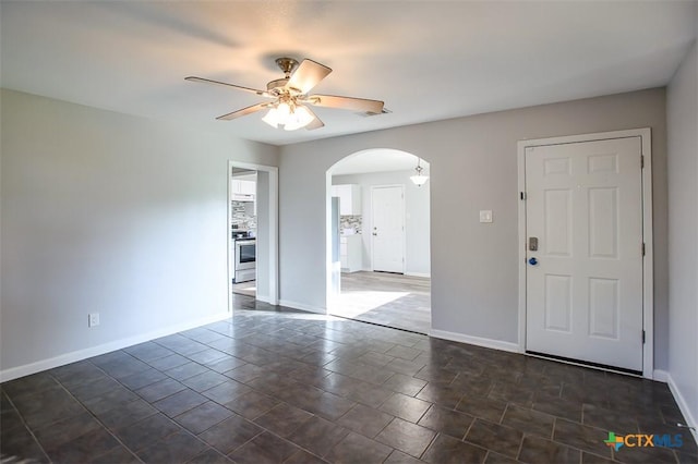 1504 Phyllis Dr, Copperas Cove, TX 76522 - unfurnished room with arched walkways and a ceiling fan