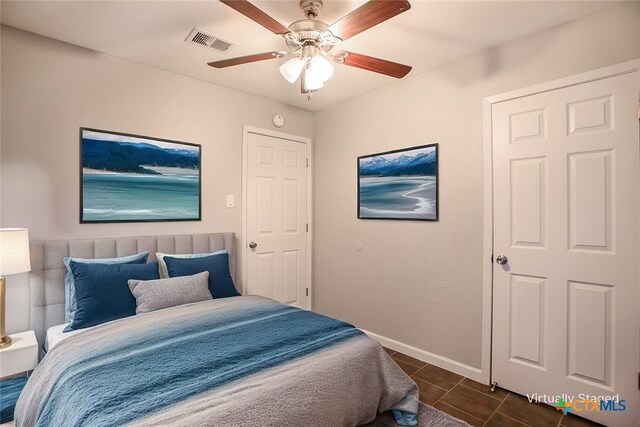 1504 Phyllis Dr, Copperas Cove, TX 76522 - bedroom with dark tile patterned flooring and ceiling fan