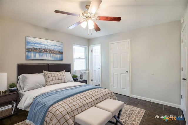 1504 Phyllis Dr, Copperas Cove, TX 76522 - bedroom with ceiling fan and dark tile patterned flooring