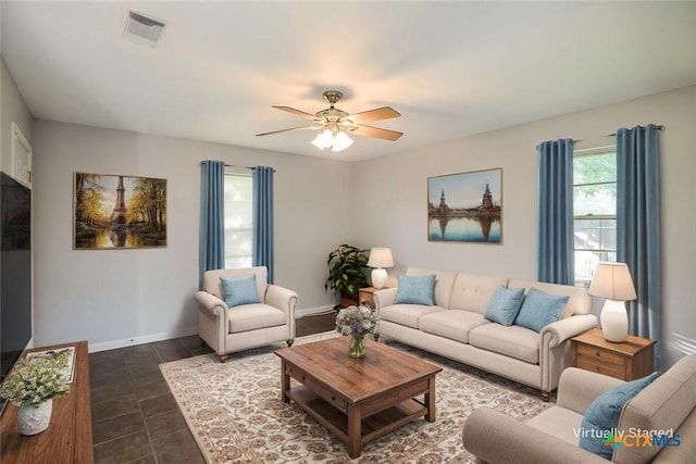 1504 Phyllis Dr, Copperas Cove, TX 76522 - living room featuring a ceiling fan and dark tile patterned floors