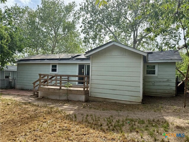 rear view of house with a deck