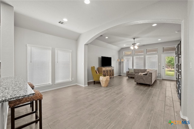 646 Arroyo Loma, New Braunfels, TX 78130 - living room with a ceiling fan, light wood-type flooring, arched walkways, baseboards, and recessed lighting