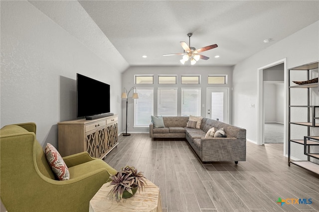 646 Arroyo Loma, New Braunfels, TX 78130 - living area with a ceiling fan, wood finished floors, baseboards, recessed lighting, and vaulted ceiling