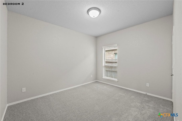 646 Arroyo Loma, New Braunfels, TX 78130 - carpeted spare room featuring baseboards and a textured ceiling