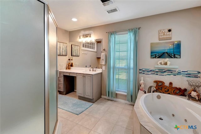 612 W Jackson Ave, Port Oconnor, TX 77982 - full bath featuring tile patterned floors, a whirlpool tub, vanity, a stall shower, and recessed lighting