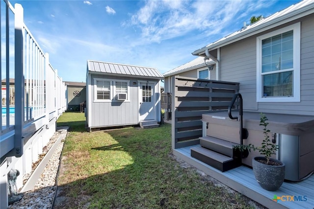 612 W Jackson Ave, Port Oconnor, TX 77982 - rear view of house with a storage unit, an outdoor structure, a yard, and a deck