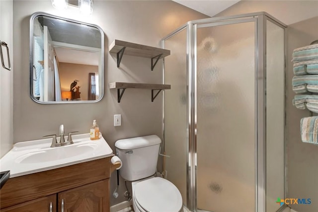 612 W Jackson Ave, Port Oconnor, TX 77982 - bathroom with a shower stall, toilet, and vanity