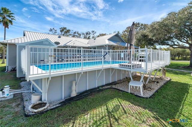 612 W Jackson Ave, Port Oconnor, TX 77982 - outdoor pool with a wooden deck and a lawn