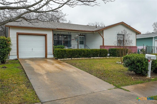 ranch-style home featuring a front yard and a garage